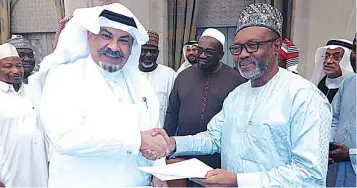  ?? ?? Malam Ahmad Arabi ( right) and Dr. Ahmad Sindhi during the signing ceremony in Makkah, Saudi Arabia… last Sunday