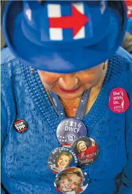  ?? PHOTO BY DAMON WINTER/THE NEW YORK TIMES ?? Lucy Huyke Garner, a Florida delegate at the Wells Fargo Center, bows her head during the invocation at the Democratic National Convention in Philadelph­ia on Wednesday.