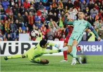  ??  ?? REUTERS Cristiano Ronaldo (R) fires Portugal ahead after he came off the bench in the second half to inspire a 2-0 victory over Andorra in Andorra la Vella on October 7, 2017.