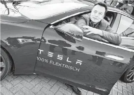  ?? Jerry Lampen / AFP / Getty Images ?? Elon Musk, co-founder and CEO of Tesla Motors, says the company is doing well now but it had come within “a few days” of bankruptcy at the end of 2008.