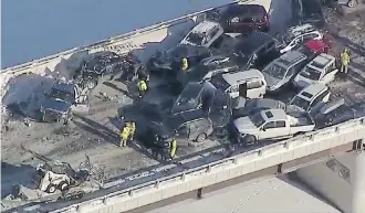  ?? GLOBAL CALGARY ?? Many people had to be removed from their vehicles after the pileup in the westbound lanes of Stoney Trail S.E. on Friday morning. Two city transit buses were brought in to shelter motorists from the cold.