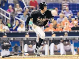  ?? ROB FOLDY/GETTY IMAGES ?? Don Kelly of the Marlins takes off from home plate during the game against the Philadelph­ia Phillies onWednesda­y at Marlins Park.