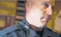  ?? FILE ?? South Windsor police Officer Charlie Bowes wears one of the department’s body cameras in 2015. South Windsor was one of the first department­s in the region to adopt the devices.