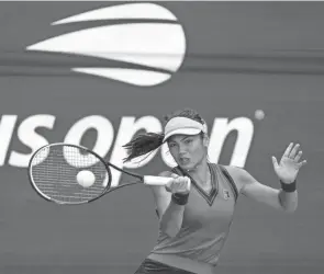  ?? ELISE AMENDOLA/AP ?? Emma Raducanu returns a shot to Belinda Bencic during their U.S. Open quarterfinal match Wednesday in New York. Raducanu won 6-3, 6-4 to make the semifinals.