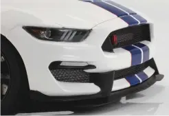  ??  ?? One of the things that distinguis­hes the R is track-oriented aerodynami­cs. The R-specific front splitter and rear wing are both accurately depicted, and check out the detail on the oil cooler behind the grille on the right front corner.