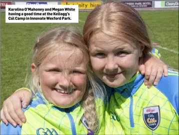 ??  ?? Karolina O’Mahoney and Megan White having a good time at the Kellogg’s Cúl Camp in Innovate Wexford Park.