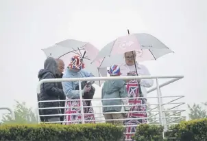  ?? ?? Coronation Day racing at Goodwood in the rain | Clive Bennett