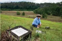  ??  ?? Bernadette O’Sullivan (left), who runs Pee Dee today with Andrew O’Sullivan, shows the markers near their homestead that indicate past flood heights. The river lies among the trees in the far distance.