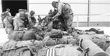  ??  ?? This October 26, 2014 file photo shows US Marines arranging their equipment as US troops arrive in Kandahar after their withdrawl from the Camp Bastion-Leathernec­k complex in Helmand province. Military leaders warned US lawmakers on February 7, 2017...