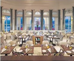  ?? DAN FORER/COURTESY ?? The new AQ Chop House by Il Mulino in Sunny Isles Beach boasts an airy, sumptuous setting amid towering arched windows looking through to an expansive terrace.