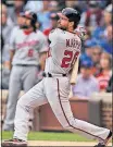  ?? [PAUL BEATY/THE ASSOCIATED PRESS] ?? The Washington Nationals’ Daniel Murphy watches his two-run home run in the first inning of Friday’s game against the Chicago Cubs in Chicago. BRAVES 5, MARLINS 3: