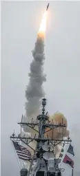  ??  ?? FIRE IN THE HOLE: A photo showing the Arleigh-Burke destroyer USS Donald Cook launching a missile, much like the one used against Syrian targets yesterday.