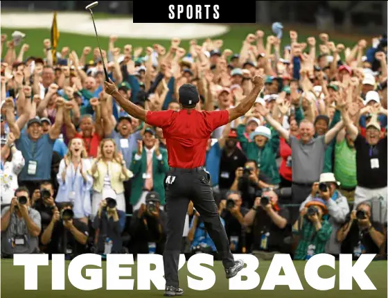  ?? —AP ?? In a scene that brought back memories of long-lost glory, Tiger Woods celebrates a major victory with an adoring audience.