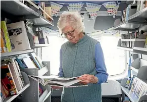  ?? ALDEN WILLIAMS/STUFF ?? Russley Village resident and keen reader Anne Brown relies on the Christchur­ch City Council mobile bus to borrow books for she and her husband.