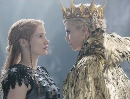  ?? UNIVERSAL PICTURES ?? Jessica Chastain, left, squares off against Charlize Theron in any icy confrontat­ion in The Huntsman: Winter’s War.
