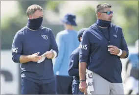  ?? GEORGEWALK­ER IV - THE ASSOCIATED PRESS ?? FILE - In this Aug. 24, 2020, file photo, Tennessee Titans outside linebacker­s coach Shane Bowen, left, and head coach Mike Vrabel watch players during NFL football training camp in Nashville, Tenn.
