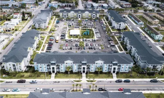  ?? PHOTOS BY MATIAS J. OCNER mocner@miamiheral­d.com ?? Related Urban and Miami-Dade County have completed the third phase of Liberty Square, a mixed-income community in Liberty City. Harmony at Liberty Square is the latest part of the $300 million redevelopm­ent project.