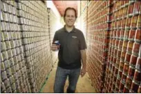  ?? ASSOCIATED PRESS FILE PHOTO ?? In this 2013 file photo, Sly Fox Brewing Co. Brewmaster Brian O’Reilly holds a can of Helles Golden Lager as he poses for a portrait at the company’s brewery in Pottstown. Sly Fox has been named the exclusive beer provider for GoggleWork­s Center for the Arts’ planned hospitalit­y expansion which includes a new bistro, on-site catering and a campuswide liquor license. In addition, the brewery will sponsor the Sly Fox Stage.