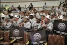  ?? JOHN LOCHER — THE ASSOCIATED PRESS FILE ?? This file photo shows laborers union members cheering during a meeting of the Las Vegas Stadium Authority board, in Las Vegas.