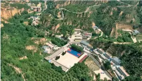  ?? Photo: Xinhua/Zhang Bowen ?? Aerial photo taken on July 29, 2020 shows a view of Liangjiahe Village of Yanchuan County in Yan’an, northwest China’s Shaanxi Province.