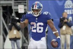  ?? BILL KOSTROUN — THE ASSOCIATED PRESS ?? Giants running back Saquon Barkley celebrates after rushing 68 yards for a touchdown during seasonopen­ing loss to Jaguars last Sunday.