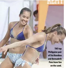  ??  ?? THE top Philippine pair of Sisi Rondina and Bernadeth Pons have fun on the sand.