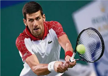  ?? — AP ?? Sharp: Novak Djokovic hits a return shot to Alexander Zverev during their men’s singles semi-finals match in the Shanghai Masters yesterday.