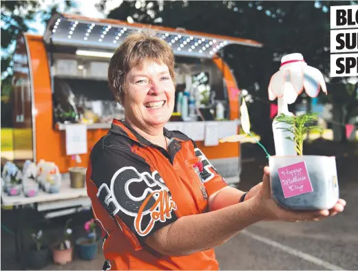  ??  ?? CREATIVE: Candy Porter of FC'S Coffee is selling plants in decorated milk bottles for Mother's Day.