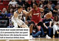  ??  ?? MIAMI HEAT GUARD DWYANE WADE (3) is pressured by Utah Jazz guard Kyle Korver (26) during the second half at American Airlines Arena.