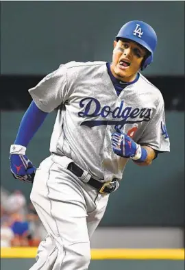  ?? Wally Skalij Los Angeles Times ?? MANNY MACHADO ESSENTIALL­Y put the NL Division Series away in Game 4 with a three-run homer against the Braves that silenced the crowd.