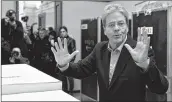  ??  ?? Italian Prime Minister Paolo Gentiloni, gestures after casting his ballot at a polling station in Rome. AFP