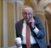  ?? J. SCOTT APPLEWHITE - THE ASSOCIATED PRESS ?? Senate Majority Leader Chuck Schumer, D-N.Y., arrives at the Capitol on Thursday while Republican­s hold a closeddoor meeting after blocking a bipartisan border package that had been tied to wartime aid for Ukraine.