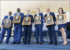  ?? HANS PENNINK — THE ASSOCIATED PRESS ?? National Baseball Hall of Fame inductees Harold Baines, Lee Smith, Edgar Martinez, Mike Mussina, Mariano Rivera and Brandy Halladay, widow of the late Roy Halladay, hold their plaques for photos after the induction ceremony at Clark Sports Center on Sunday in Cooperstow­n, N.Y.