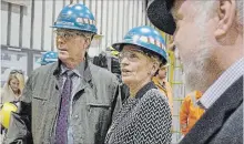  ?? CATHIE COWARD THE HAMILTON SPECTATOR ?? Mayor Fred Eisenberge­r, Premier Kathleen Wynne and MPP Ted McMeekin are given a tour of the zinc line at Stelco Wednesday.