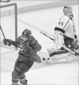  ?? Jim Mone Associated Press ?? MINNESOTA’S DARROLL POWE celebrates a goal 40 seconds into the first period. Later in the period, the Kings and Wild traded goals over a 17-second span.