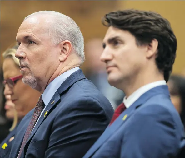  ?? — THE CANADIAN PRESS FILES ?? Prime Minister Justin Trudeau, right, said on Wednesday that B.C. Premier John Horgan, left, ‘is actually trying to scuttle our national plan on fighting climate change.’