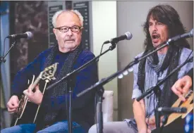  ?? Canadian Press photo ?? Members of the rock band Foreigner, Mick Jones, left, and Kelly Hansen, perform at a news conference about an upcoming musical called “Jukebox Hero”in Calgary.