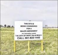 ?? TONY DORIS / THE PALM BEACH POST ?? A field on Australian Avenue, next to Lake Mangonia, would become 240 apartments.