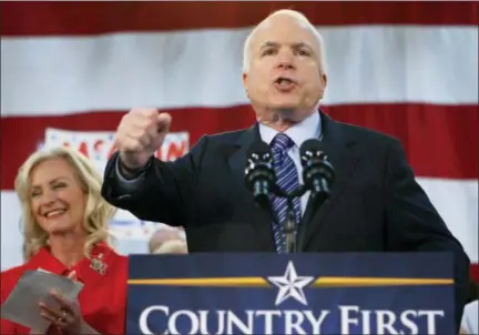  ?? AP FILE ?? Sen. John McCain, R-Ariz., speaks at an October 2008 rally in Bensalem, Pa., while running for president. At left is his wife, Cindy.