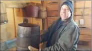  ?? PAUL POST - MEDIANEWS GROUP ?? Greg Lapan shows off an antique wooden bucket that was used to collect sap from maple trees in years gone by.
