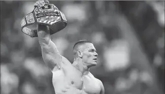  ?? FILE PHOTO ?? John Cena shot to fame in the early 2000s as one of the stars of the WWE wrestling promotion.