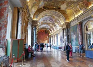  ?? JANET PODOLAK — THE NEWS-HERALD ?? The walls and ceilings of the city hall in Toulouse tell the history of this part of southwest France in paintings and statues.