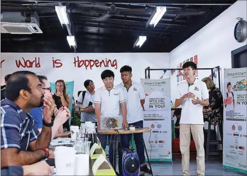  ?? SUPPLIED ?? Founders of the GoSoccer applicatio­n present to a panel of judges at the SmartStart competitio­n in Phnom Penh yesterday.