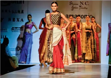  ??  ?? Models showcasing designer Shaina N.C.’s collection at the Amazon India Fashion Week ’17.