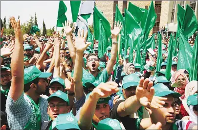  ??  ?? Palestinia­n students supporting the Hamas movement take part in an election campaign rally for the student council at the Birzeit University,
near the West Bank city of Ramallah on April 26.