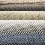  ??  ?? Multiple shades of woven sisal, in brown, blue and grey, provide ideal beach house texture and simplicity.