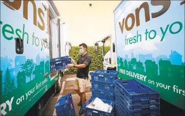  ?? Al Seib Los Angeles Times ?? DRIVER James Hang prepares an order in April. Albertsons plans to outsource delivery work to DoorDash.