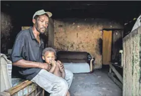  ??  ?? Dreamless living: The farm where Alfred Witbooi (above) has worked and lived for more than a decade offers broken, roofless toilets (top) and dire living quarters. He wants a better home for his young children, with drinking water in the taps. Photos: David Harrison