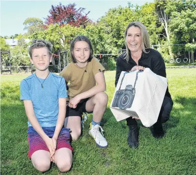  ?? PHOTO: GREGOR RICHARDSON ?? New gear . . . Excited to receive a $5000 prize after winning the Canon Ocean Grants community award are (from left) Broad Bay School pupils Anika Biggin (10) and Asher Armstrong (11), with Canon New Zealand chief executive Kim Conner.