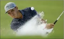  ?? CHRIS O’MEARA — THE ASSOCIATED PRESS ?? Rickie Fowler hits from the bunker on the 16th hole during the first round of the PGA Championsh­ip golf tournament at the Quail Hollow Club Thursday in Charlotte, N.C.